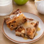 Fresh apple cake slices topped with dessert sauce.