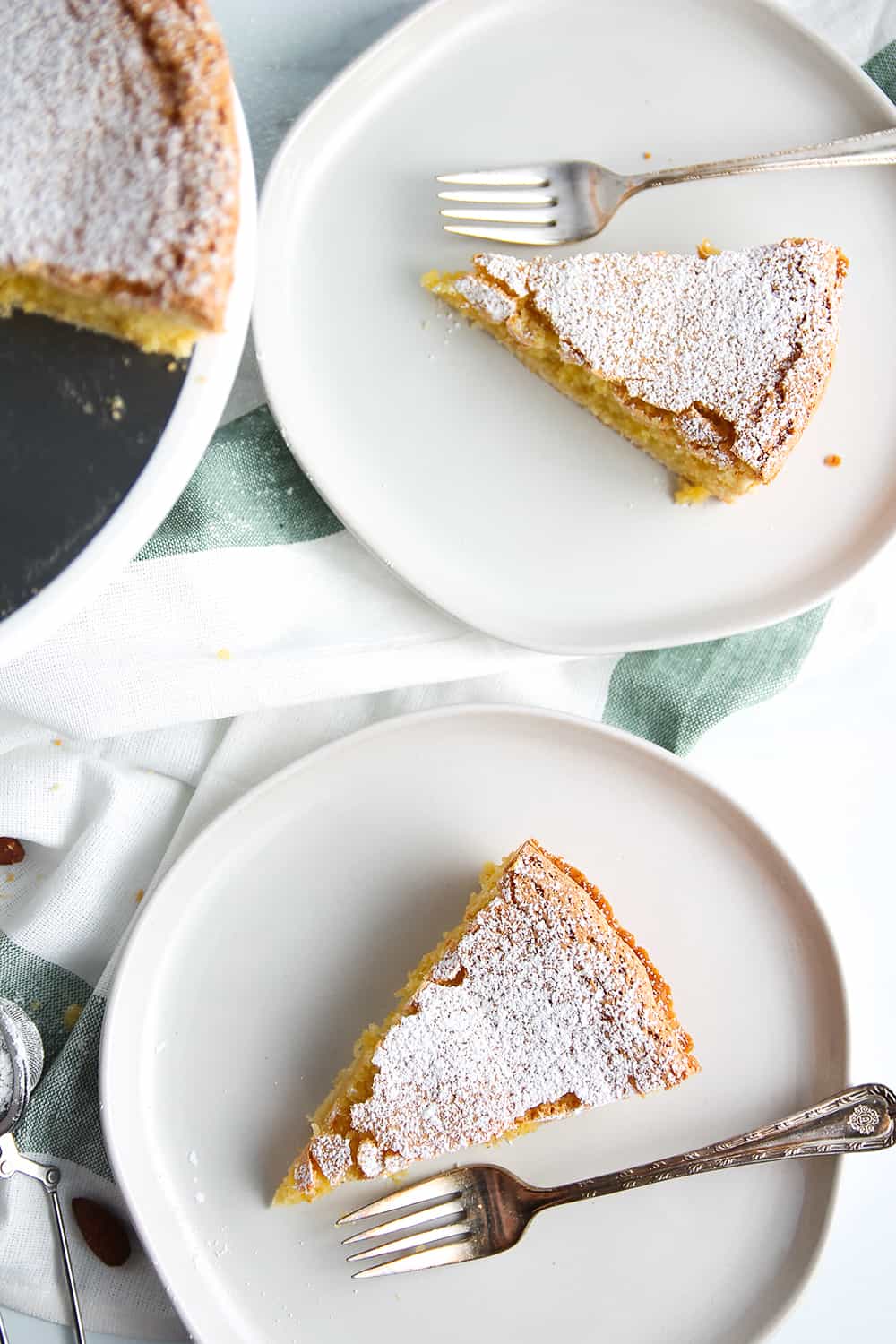 Plated slices of Galician Almond Tart dusted with powdered sugar