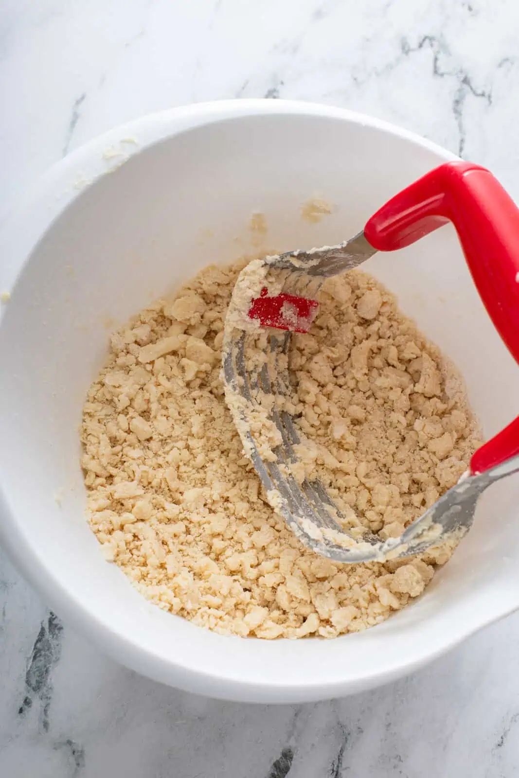 Shortening cut into flour with a pastry blender.