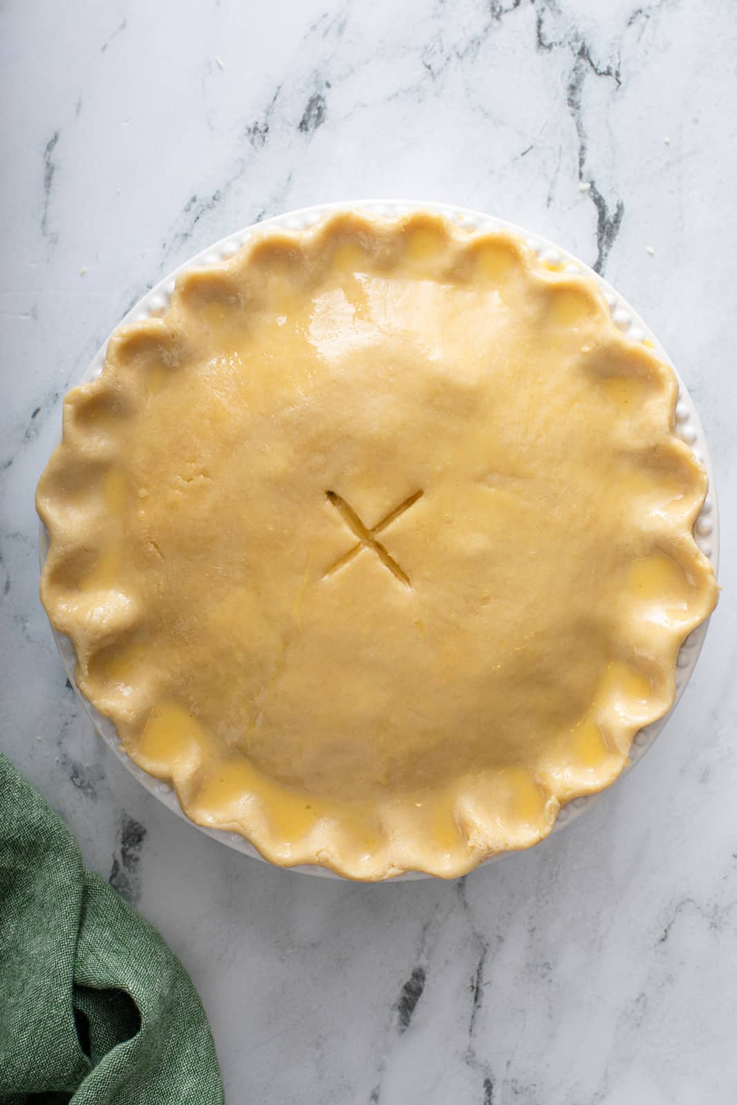 Unbaked chicken pot pie ready to go in the oven.