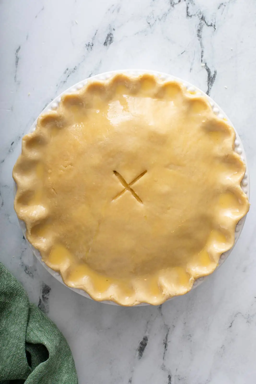 Unbaked chicken pot pie ready to go in the oven.