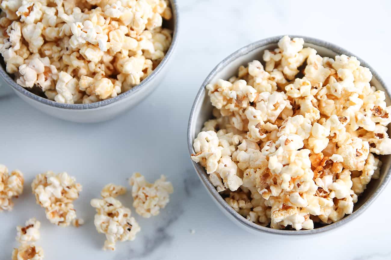 Overhead shot of two bowls of microwave caramel corn