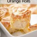 Cake server lifting up a frosted orange roll from the baking dish. Text overlay includes recipe name.