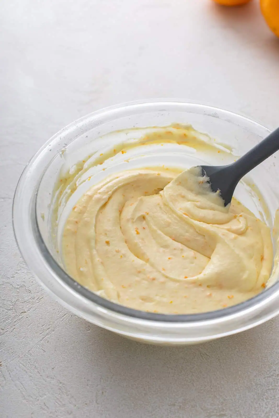 Bowl of orange icing.