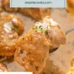 Spoon lifting up a garlic chicken thigh from a skillet. Text overlay includes recipe name.