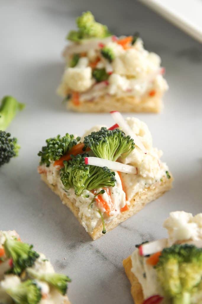 Vegetable Pizza is a delicious party appetizer, crescent roll dough topped with ranch cream cheese and chopped veggies.