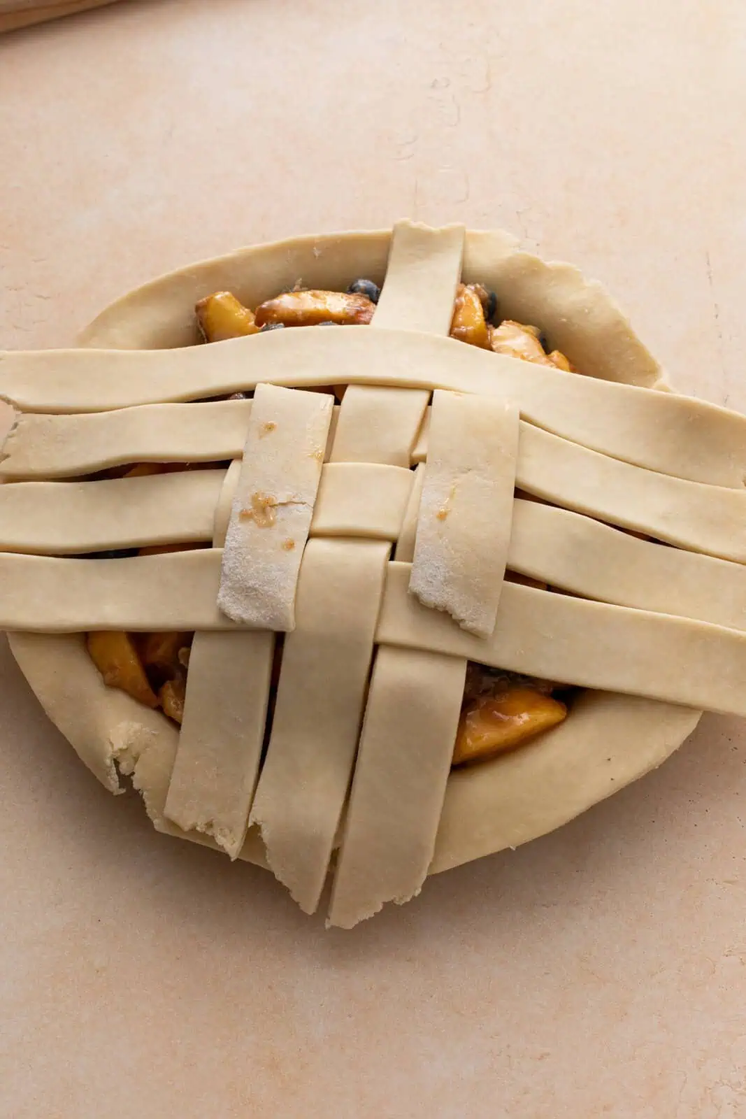 A pie with about half of the top woven into a lattice crust.
