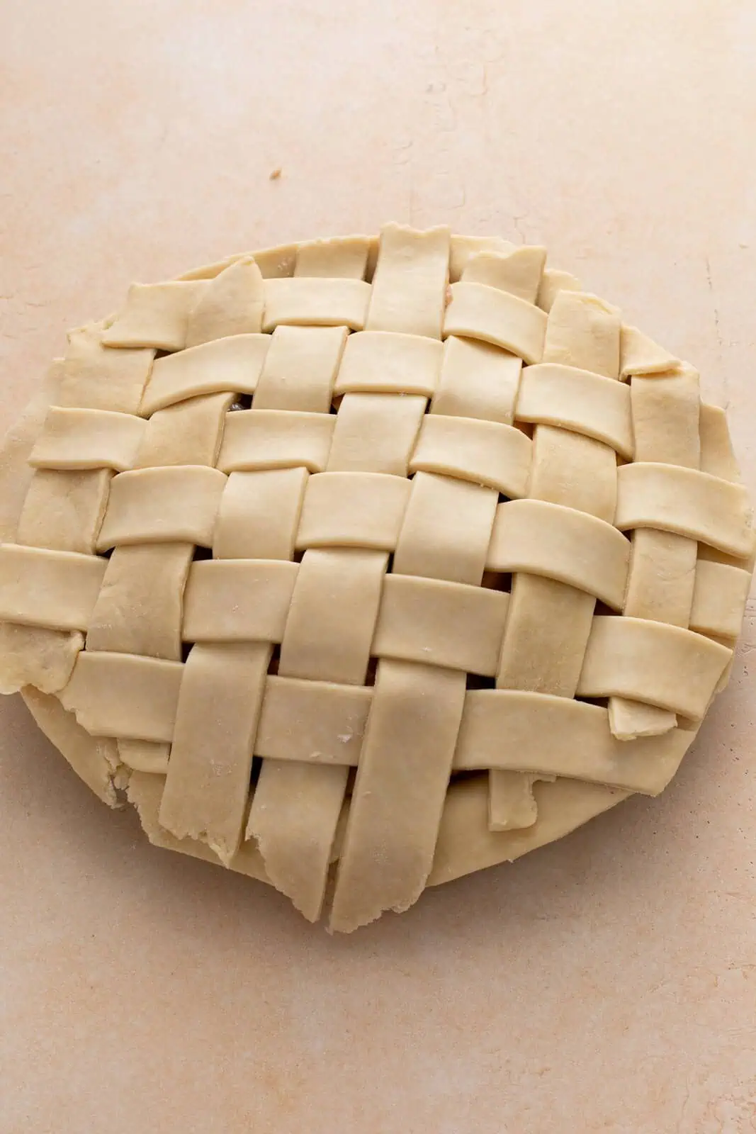 Top of a pie covered in a lattice crust top.