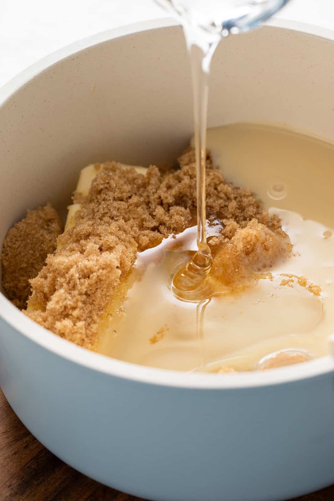 Ingredients for apple dip added to a saucepan.
