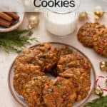 Fruitcake cookies arranged in a circle on a plate. A glass of milk is in the background. Text overlay includes recipe name.
