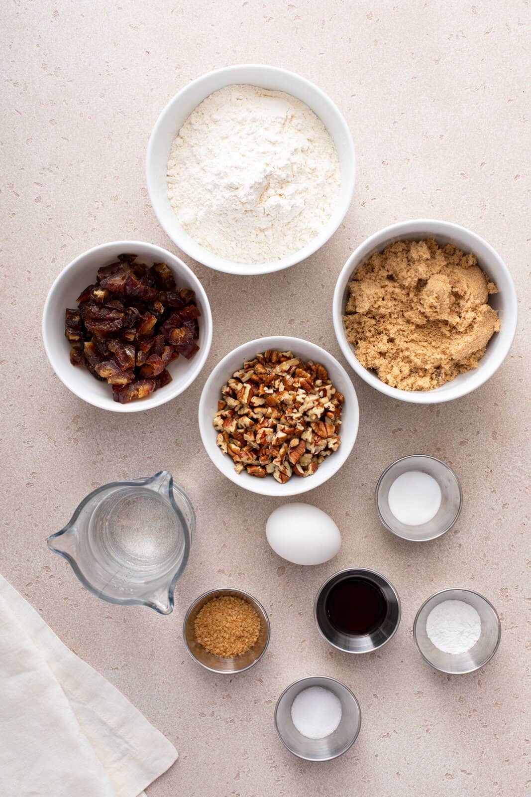 Ingredients for date nut bread arranged on a countertop.