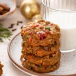 Four stacked fruitcake cookies.