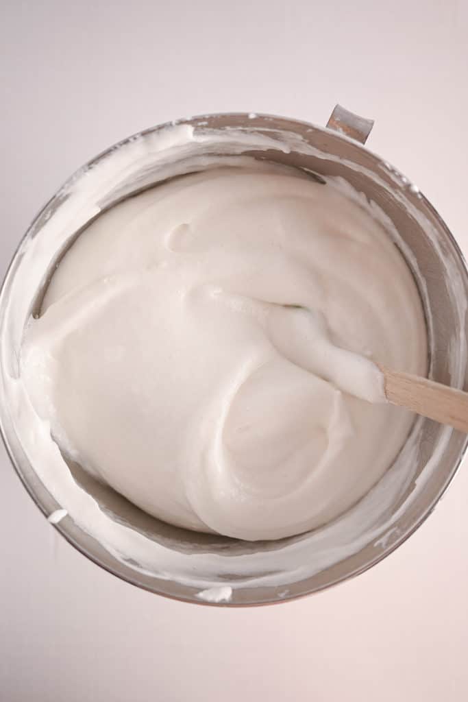 Angel food cake batter in a metal mixing bowl