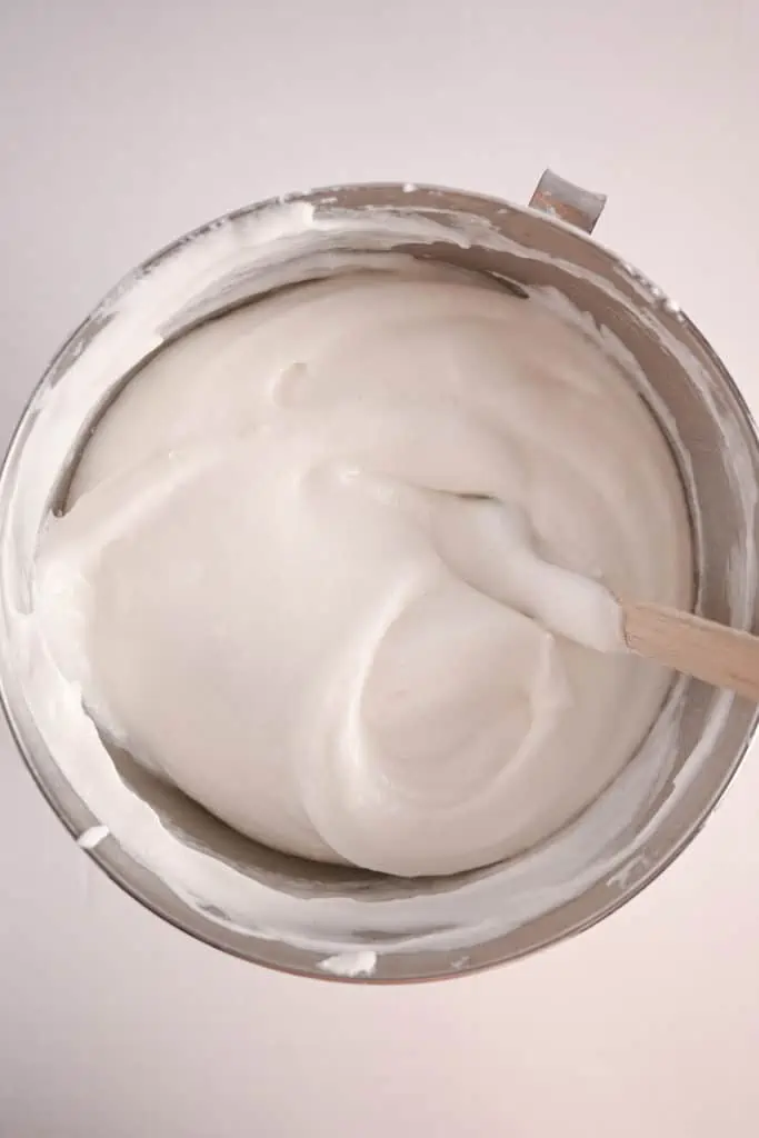 Angel food cake batter in a metal mixing bowl