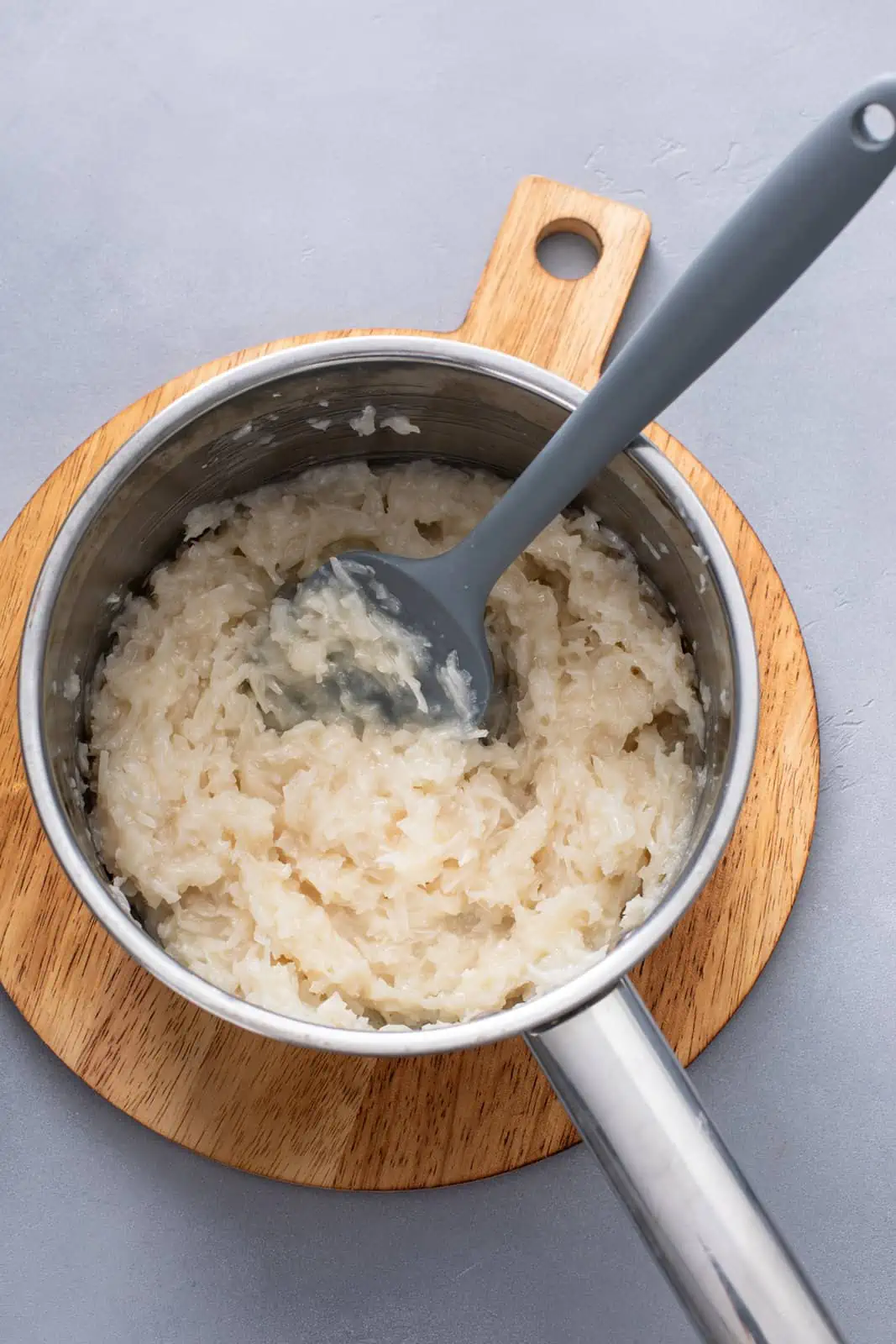 Coconut filling in a metal sauce pan.