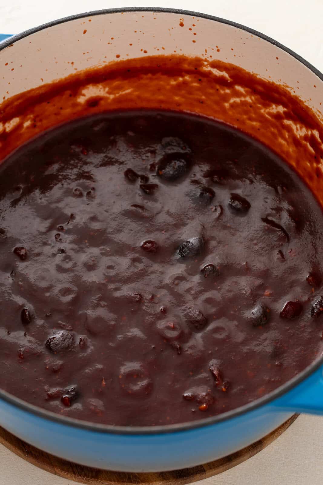 Simmered cherry barbecue sauce, ready to be pureed. The thick texture of the sauce is visible.