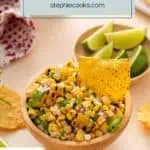 Tortilla chip in a bowl of roasted corn salsa. Text overlay includes recipe name.