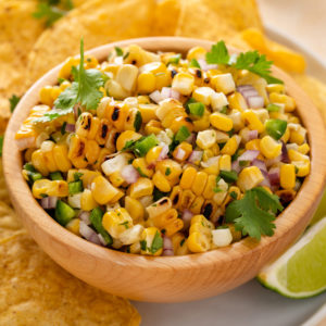 Close up bowl of roasted corn salsa.