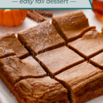 Powdered sugar being dusted over the top of a sliced pumpkin spice cake. Text overlay includes recipe name.