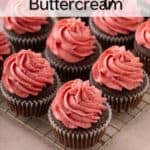 Strawberry buttercream piped onto chocolate cupcakes on a wire rack. Text overlay includes recipe name.