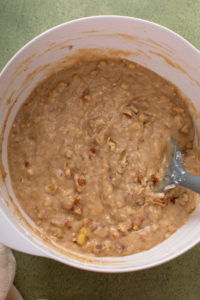 Bisquick banana bread batter mixed in a white bowl.