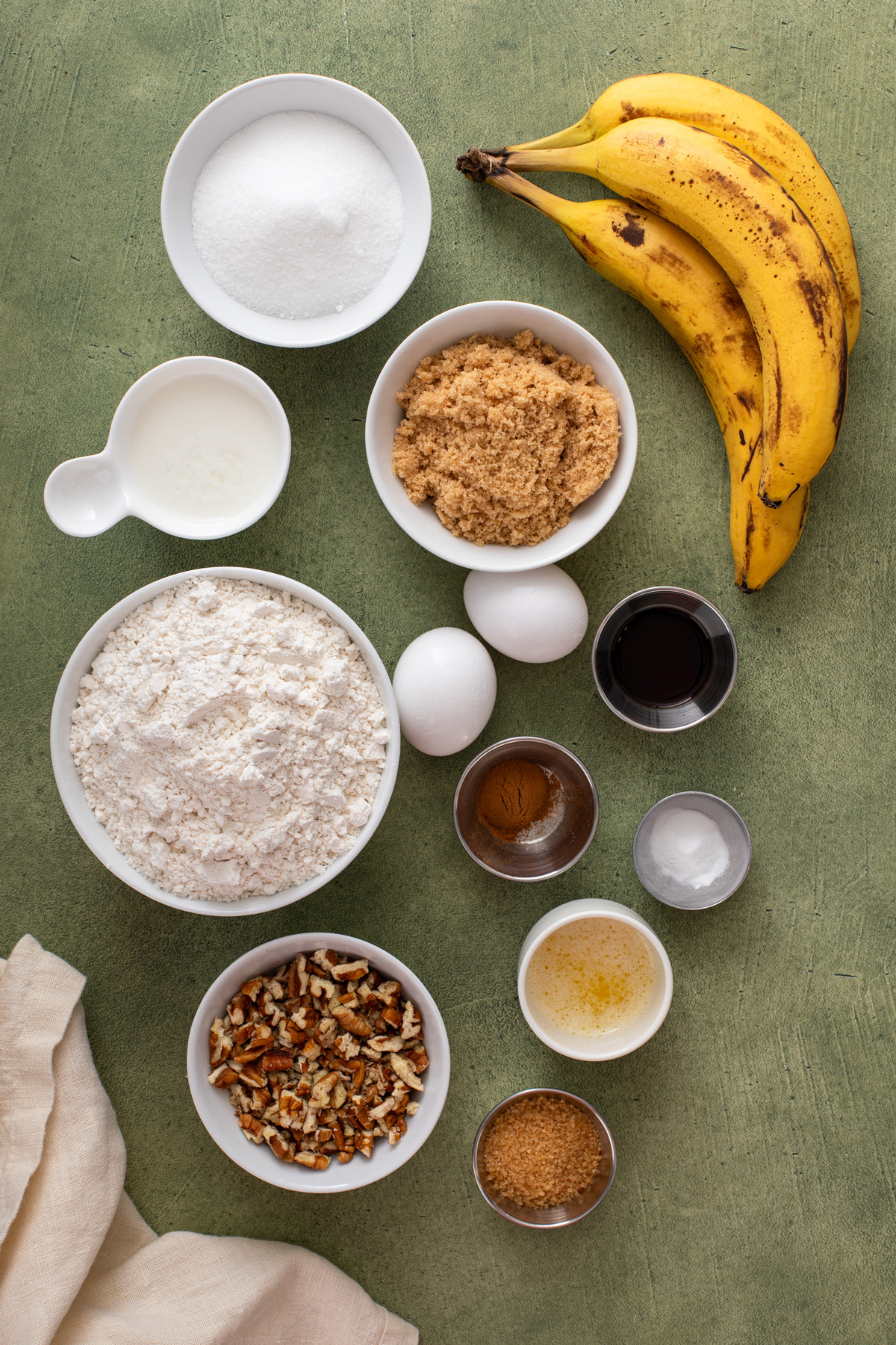 Ingredients for bisquick banana bread arranged on a countertop.
