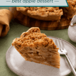 Plated slice of dutch apple pie with the rest of the pie in the background. Text overlay includes recipe name.