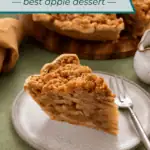 Plated slice of dutch apple pie with the rest of the pie in the background. Text overlay includes recipe name.