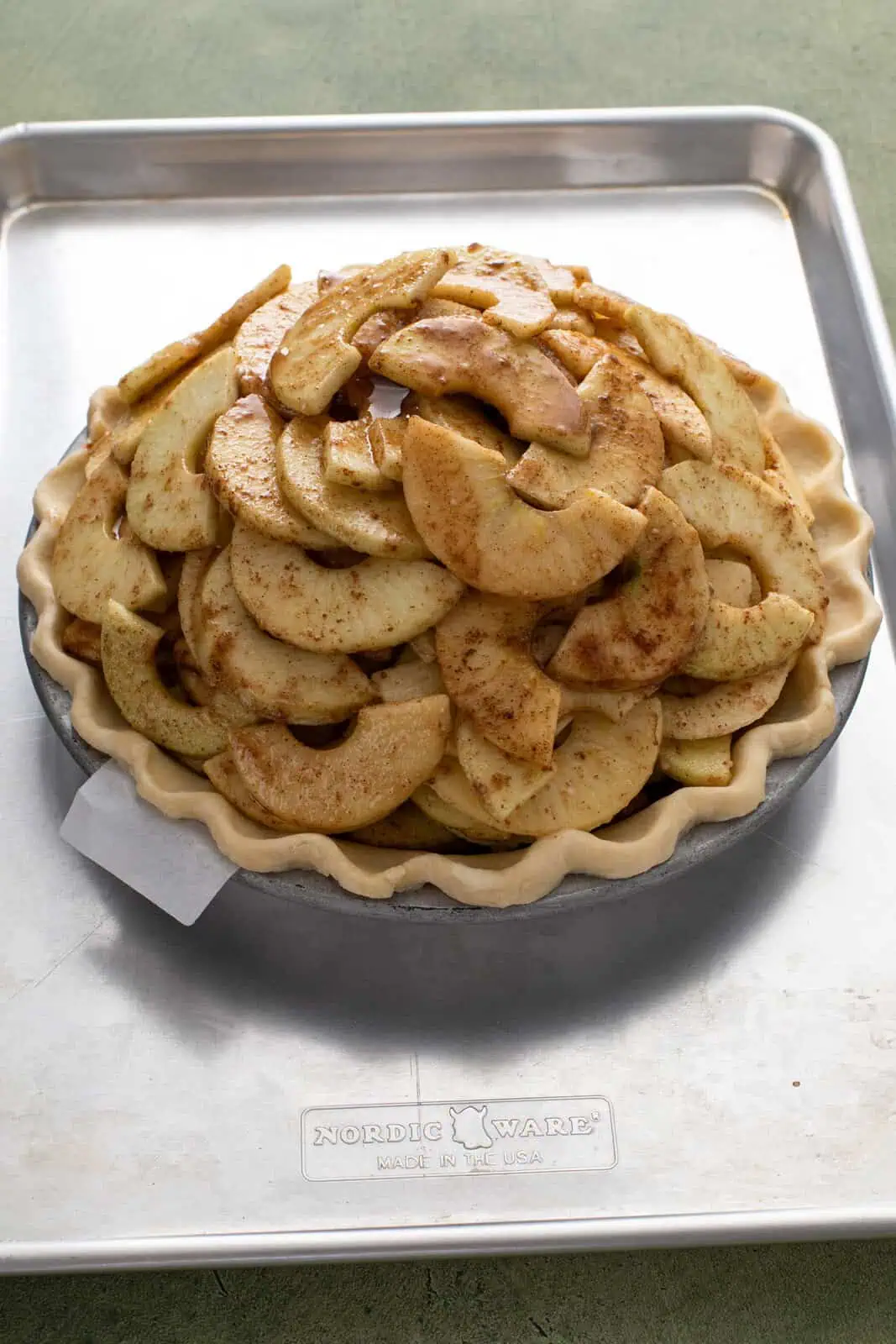 Apple filling piled high in a deep-dish pie crust.