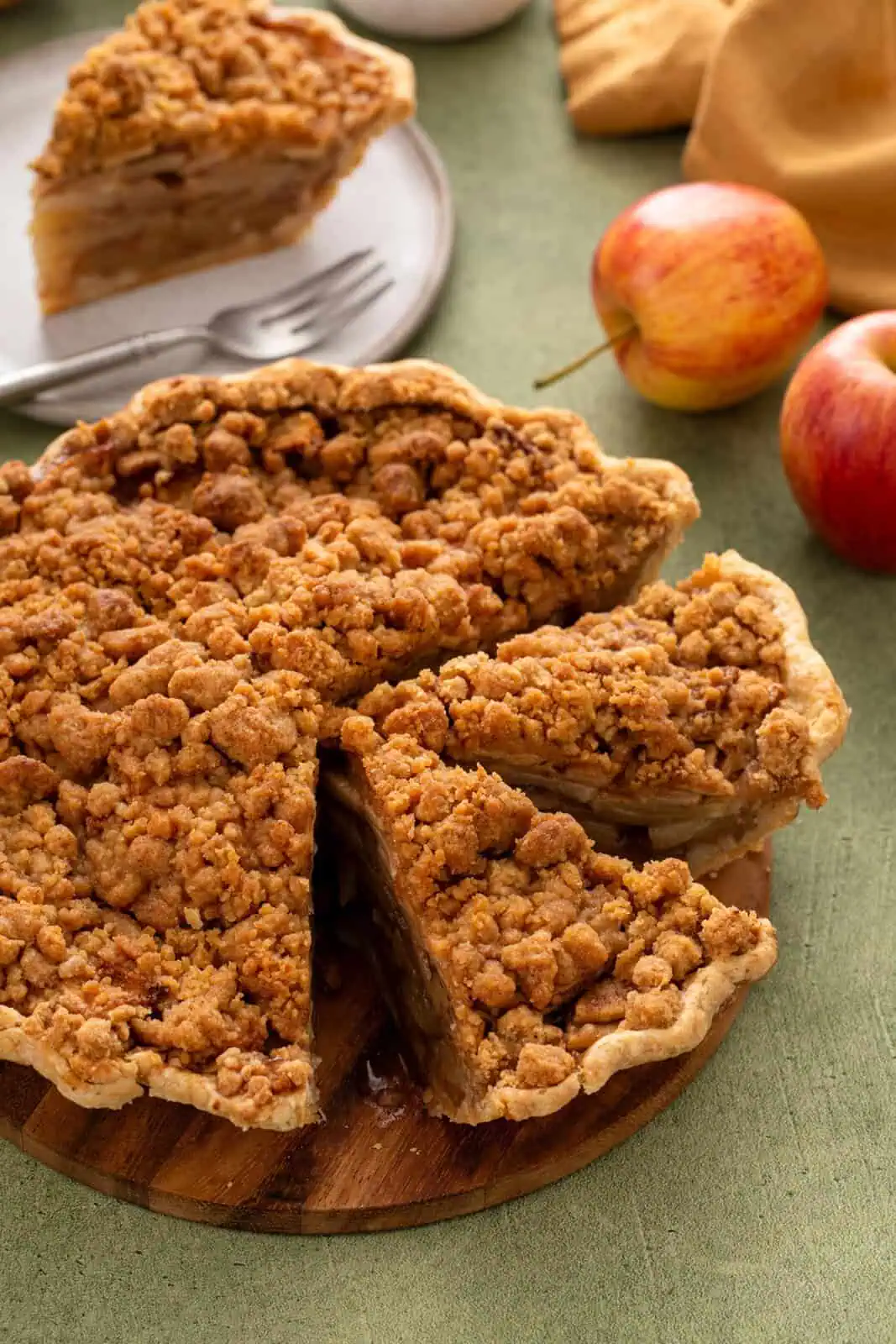 Sliced dutch apple pie with a slice removed.