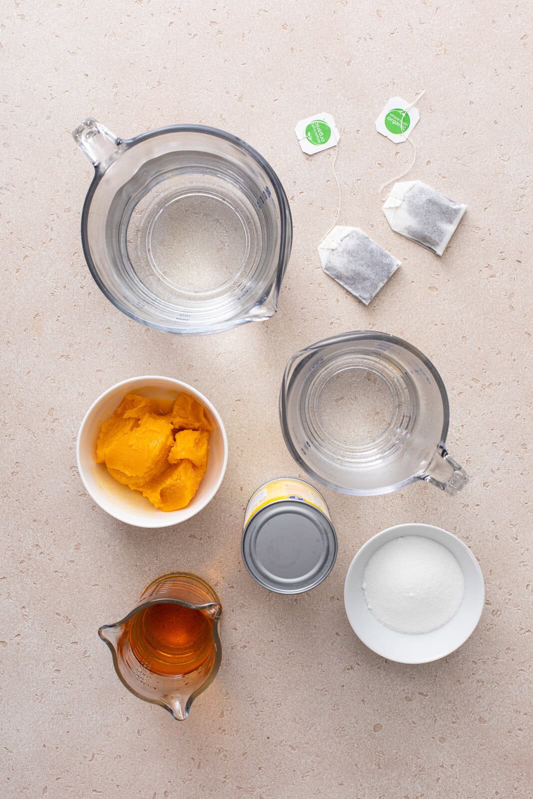 Ingredients for bourbon slush arranged on a countertop.