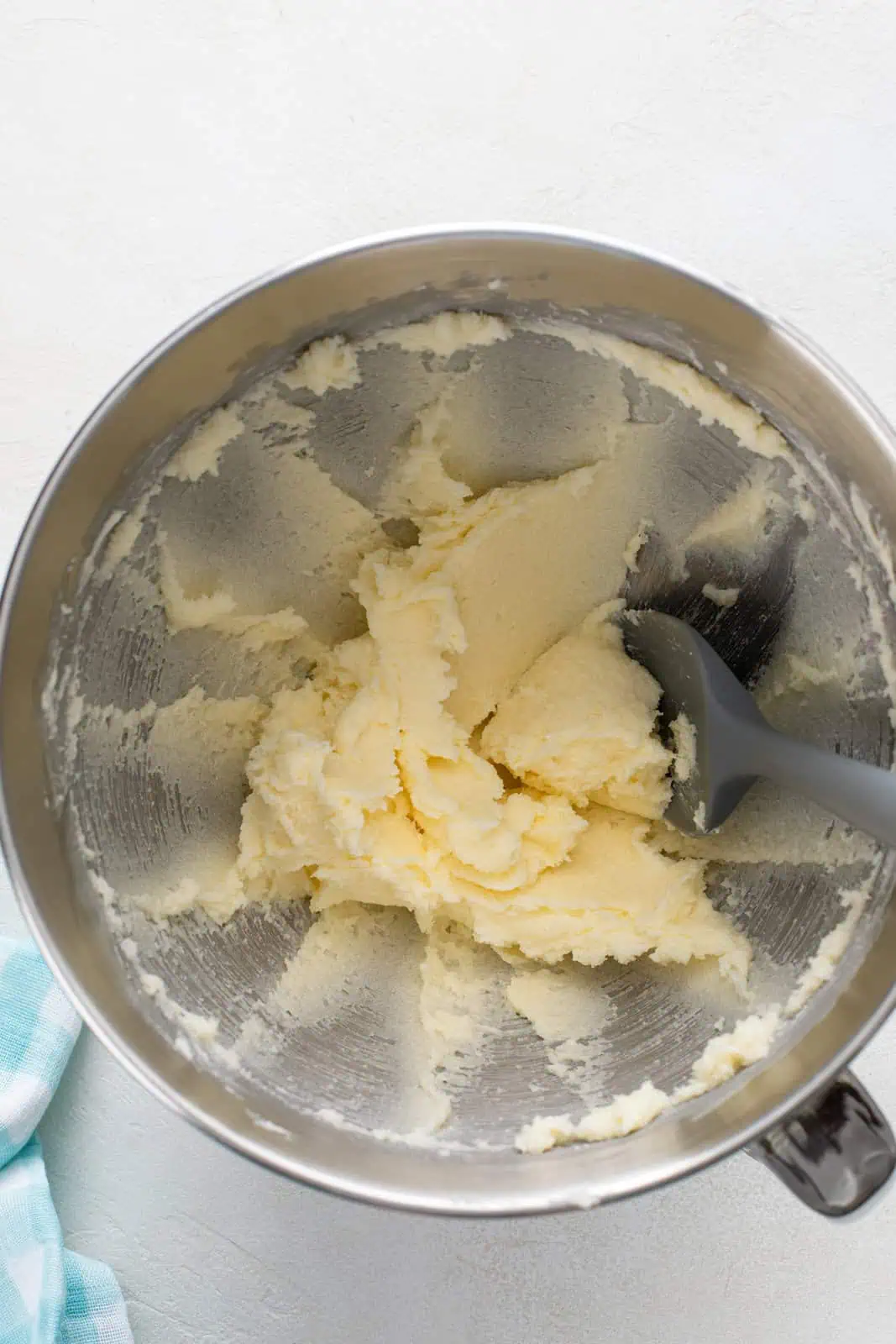 Creamed butter and sugar in a metal bowl.