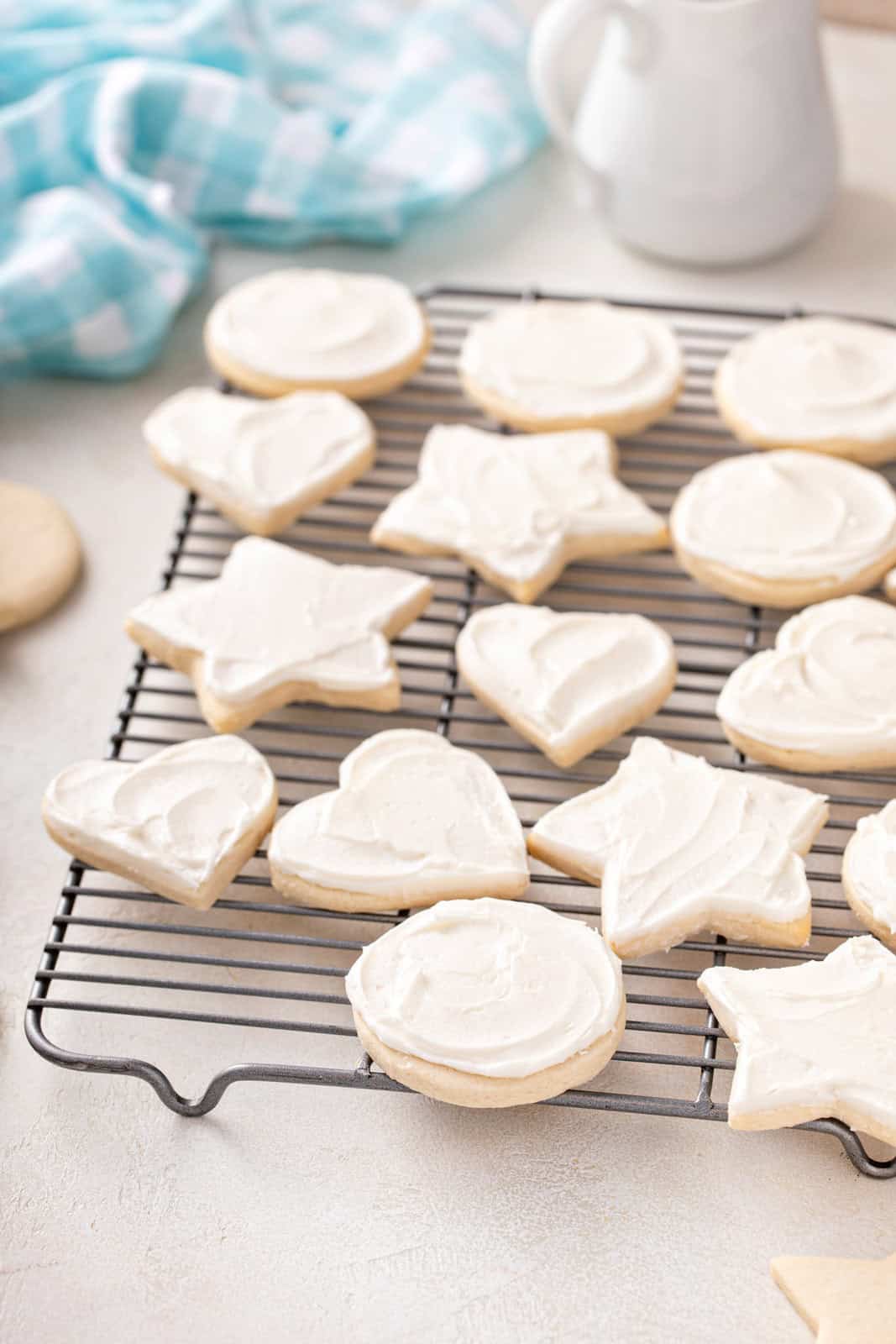 Frosted no chill sugar cookies on a wire rack.