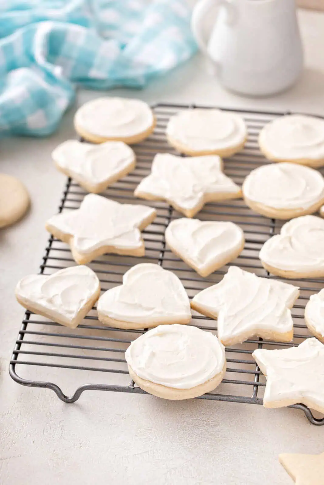 Frosted no chill sugar cookies on a wire rack.