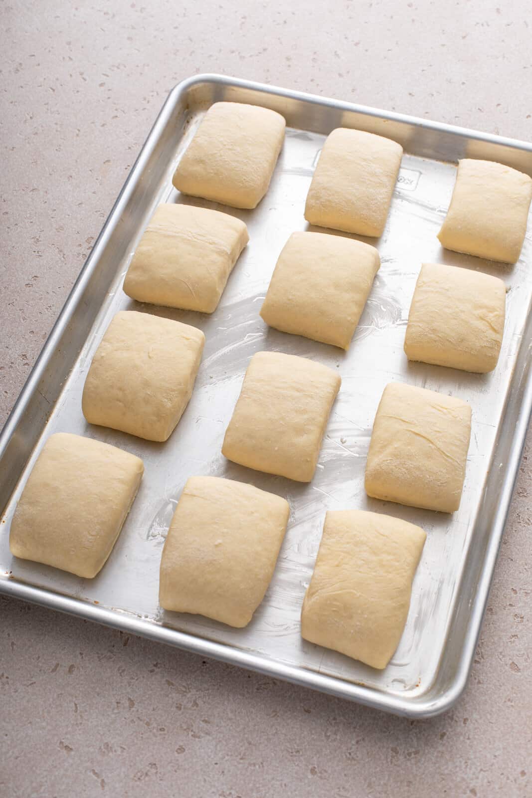 Unbaked texas roadhouse rolls ready to go in the oven.