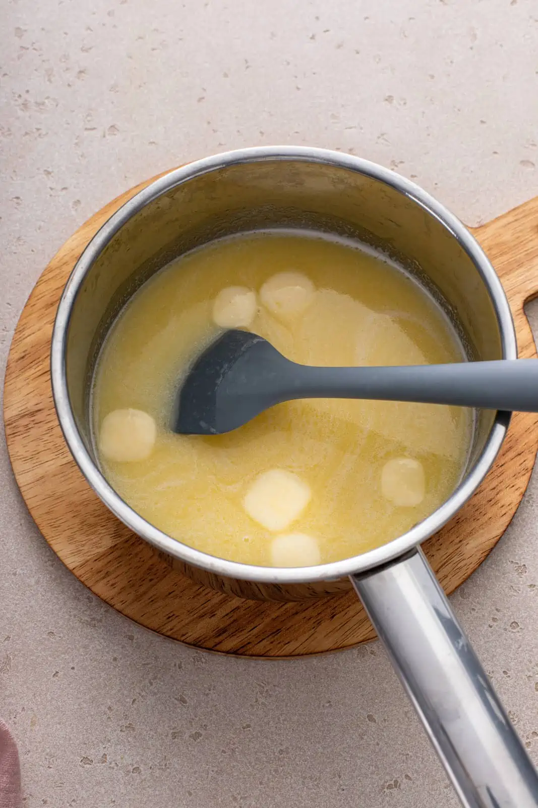 Wet ingredients for texas roadhouse rolls in a saucepan.