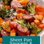 White bowl filled with sheet pan sausage and vegetables, garnished with parmesan cheese. Text overlay includes recipe name.
