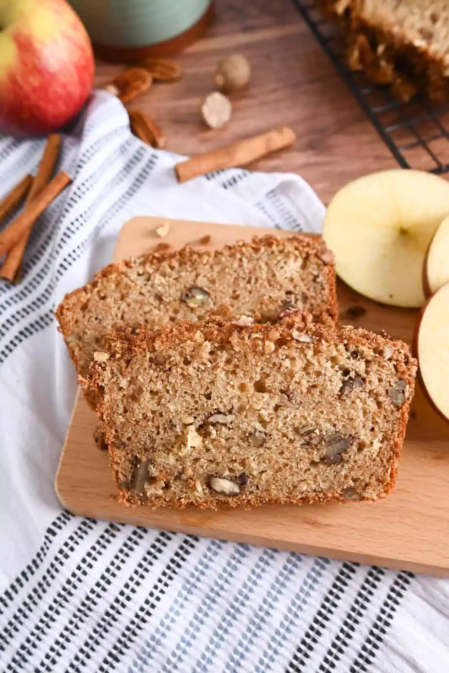 Apple sauce bread sliced on a small wooden board.