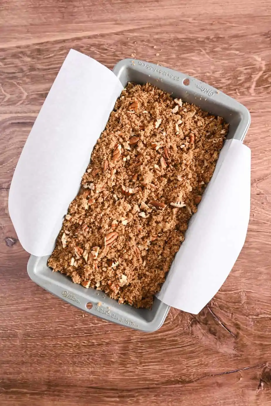 Unbaked applesauce bread in a loaf pan, ready to go in the oven.