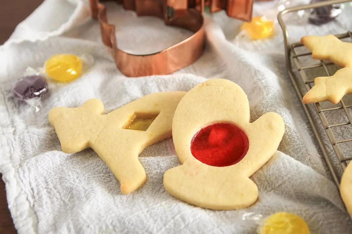 Stained Glass Cookies are a fun way to jazz up cut-out sugar cookies! Made with your favorite hard candies, these cookies are as fun to make as they are to eat.