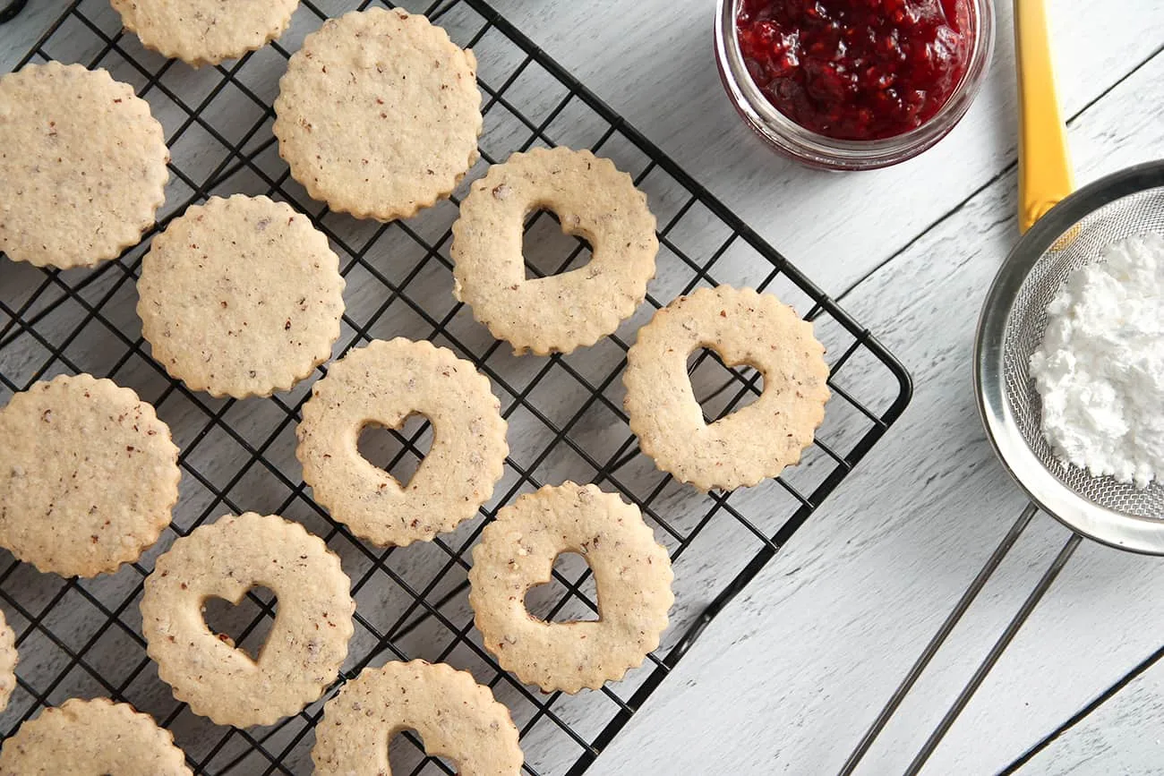 Raspberry Linzer Cookies are both bright and nutty with raspberry jam and almond cookies.