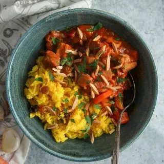 Quick Moroccan Chicken Stew is a flavorful weeknight meal, packed full of tender chicken and rich spices. Serve it alongside Ginger-Turmeric Rice for complete meal all in one bowl!