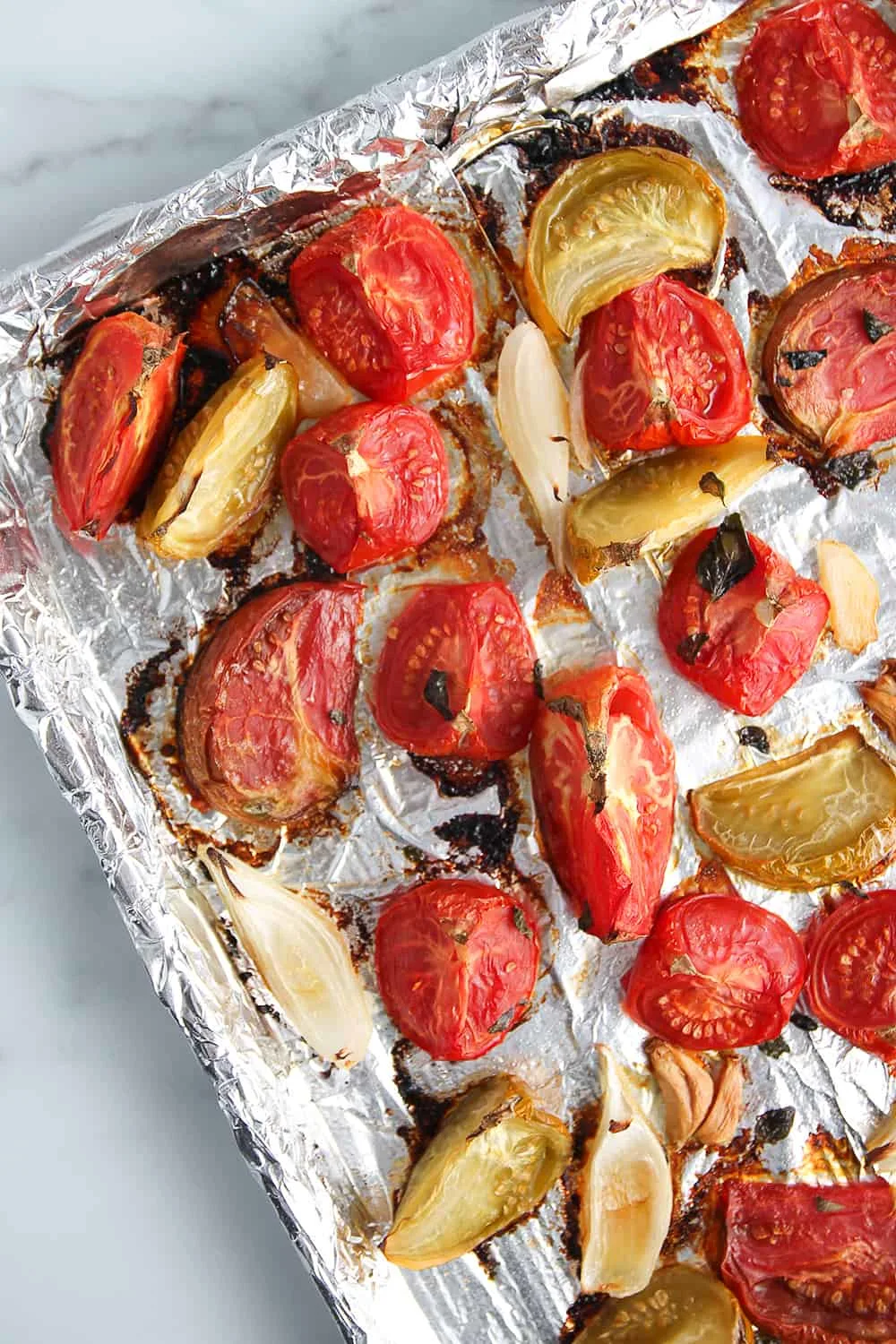 Roasted tomato sauce on a foiled-lined sheet pan