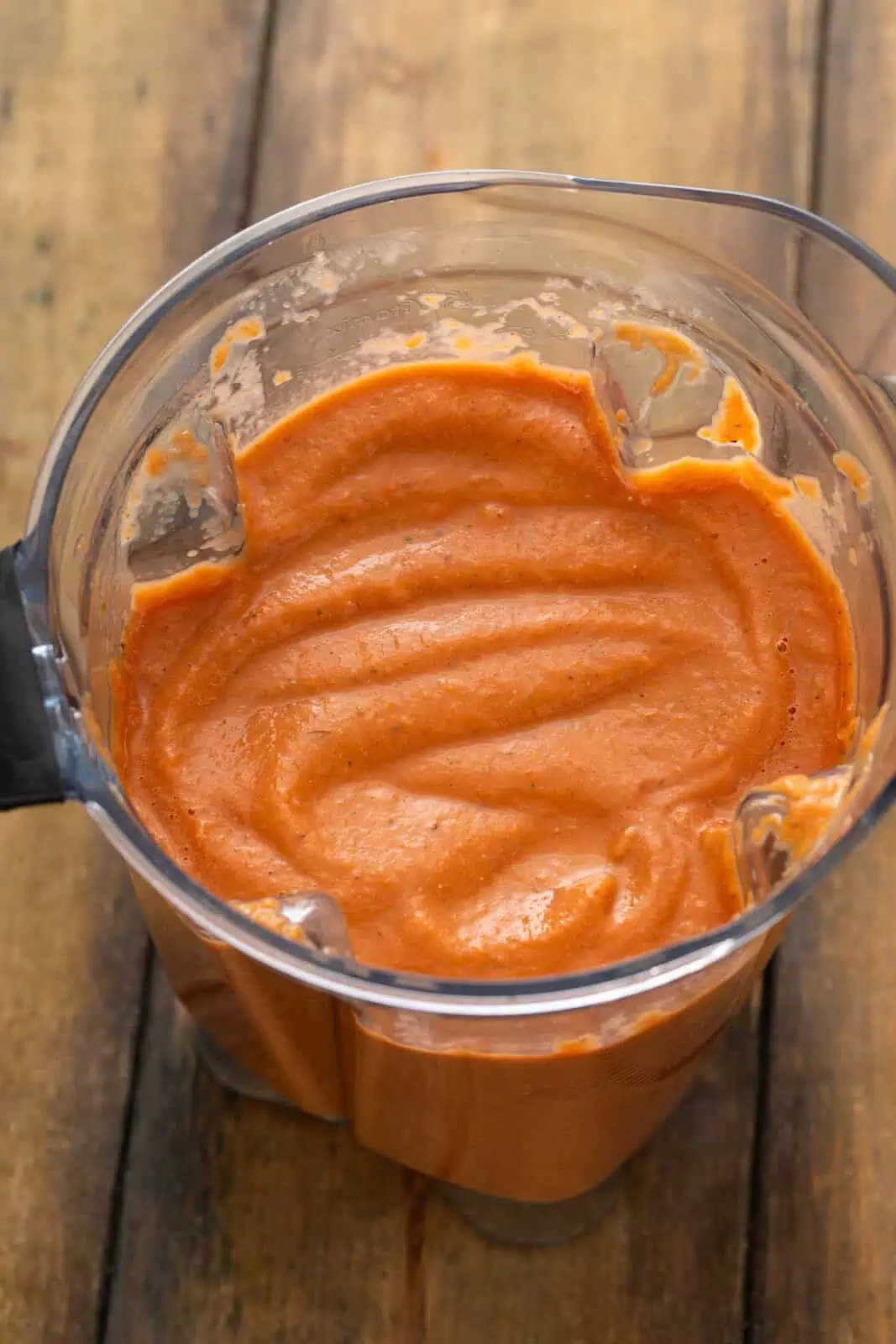 Blended roasted tomato sauce in the jar of a blender.