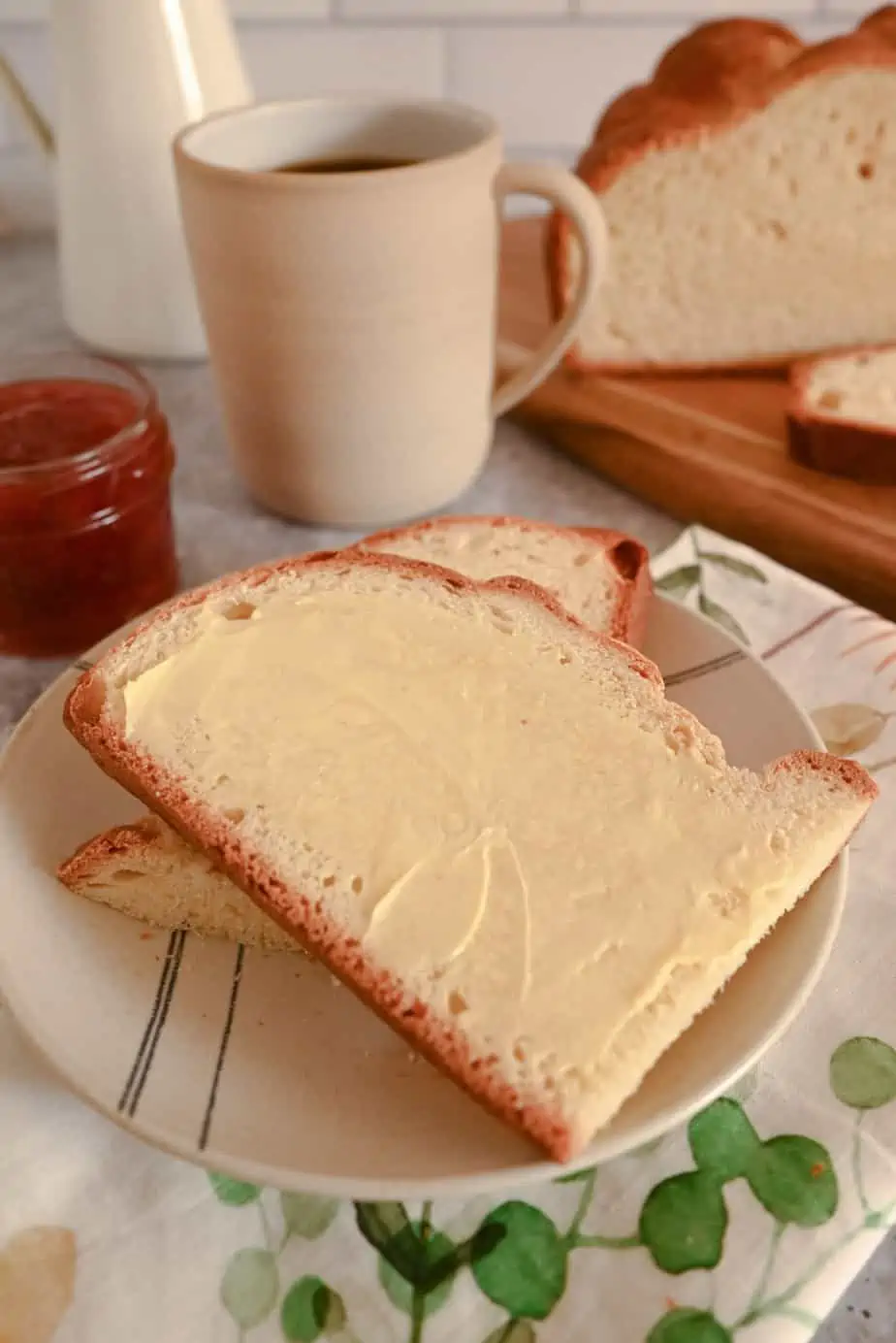 Two slices of buttered paska on a plate