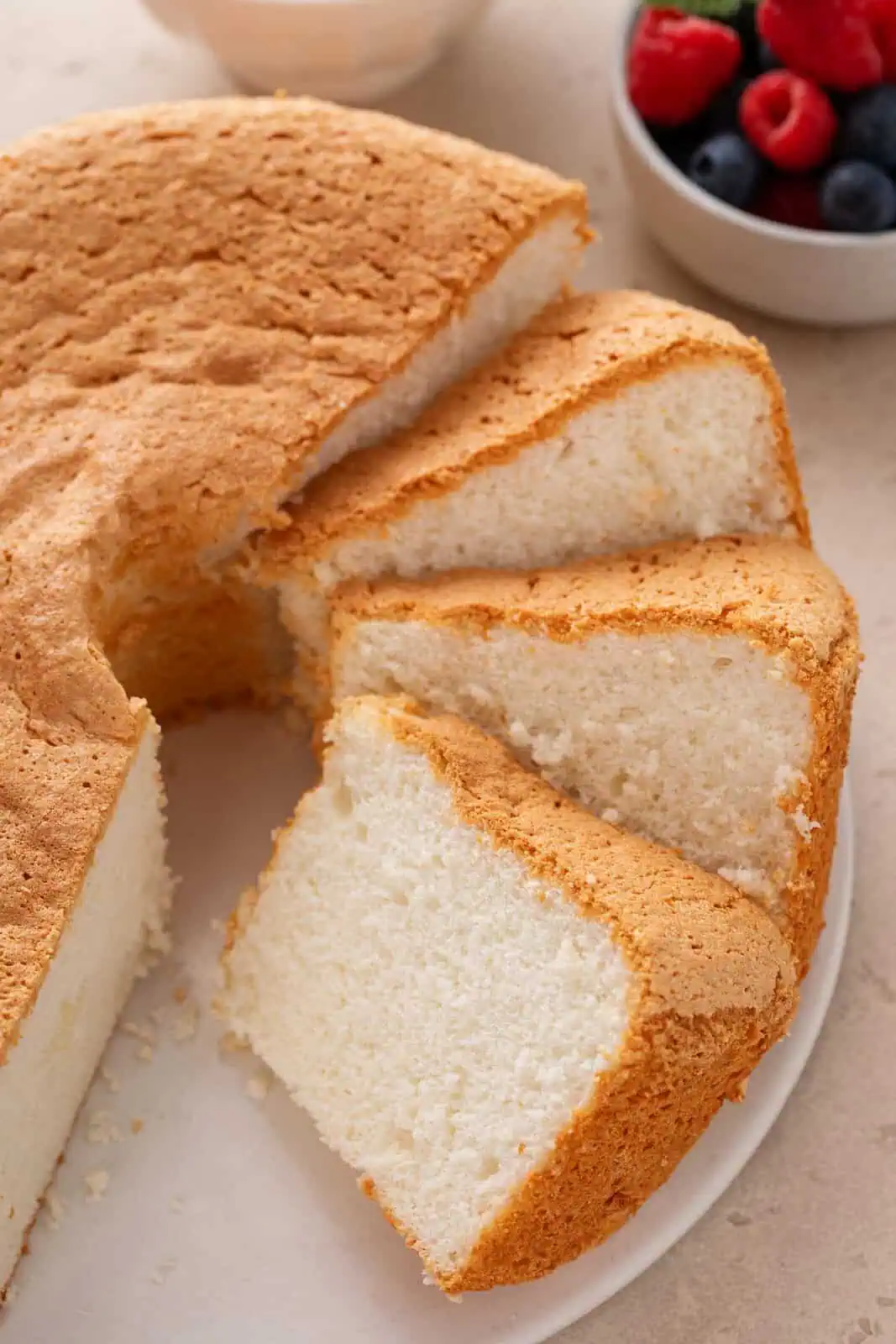 Slices of angel food cake on a cake plate.