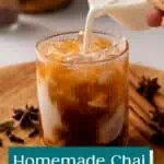 Cold milk being added to a glass filled with chai concentrate and ice. Text overlay includes recipe name.