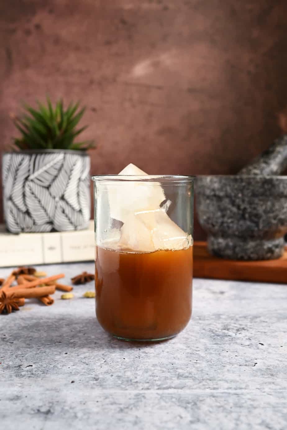 Chai concentrate and ice cubes in a glass