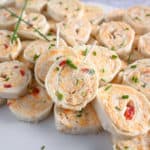 Pimento cheese pinwheels with toothpicks in them, ready to be served.