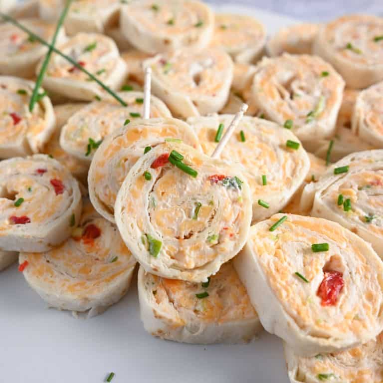 Pimento cheese pinwheels with toothpicks in them, ready to be served.